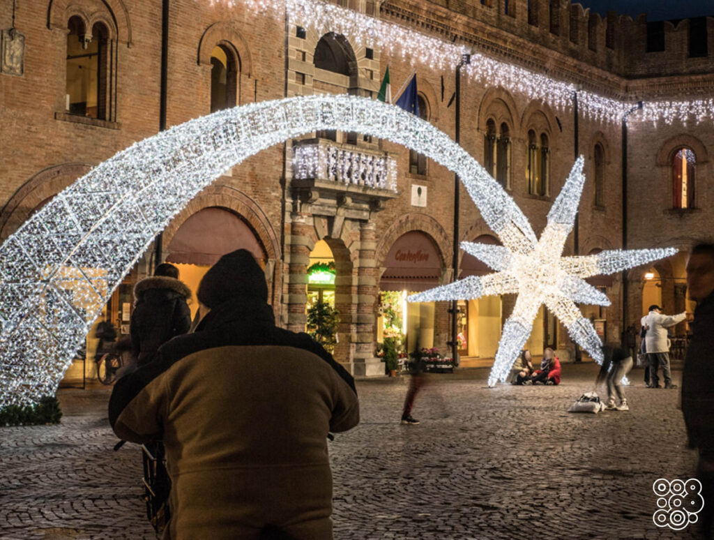 giant walk-through comet in a square with people taking pictures 