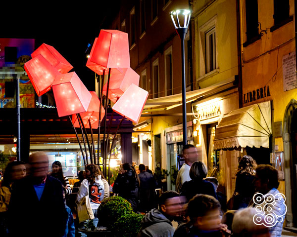 square full of people decorated with red led light lanterns